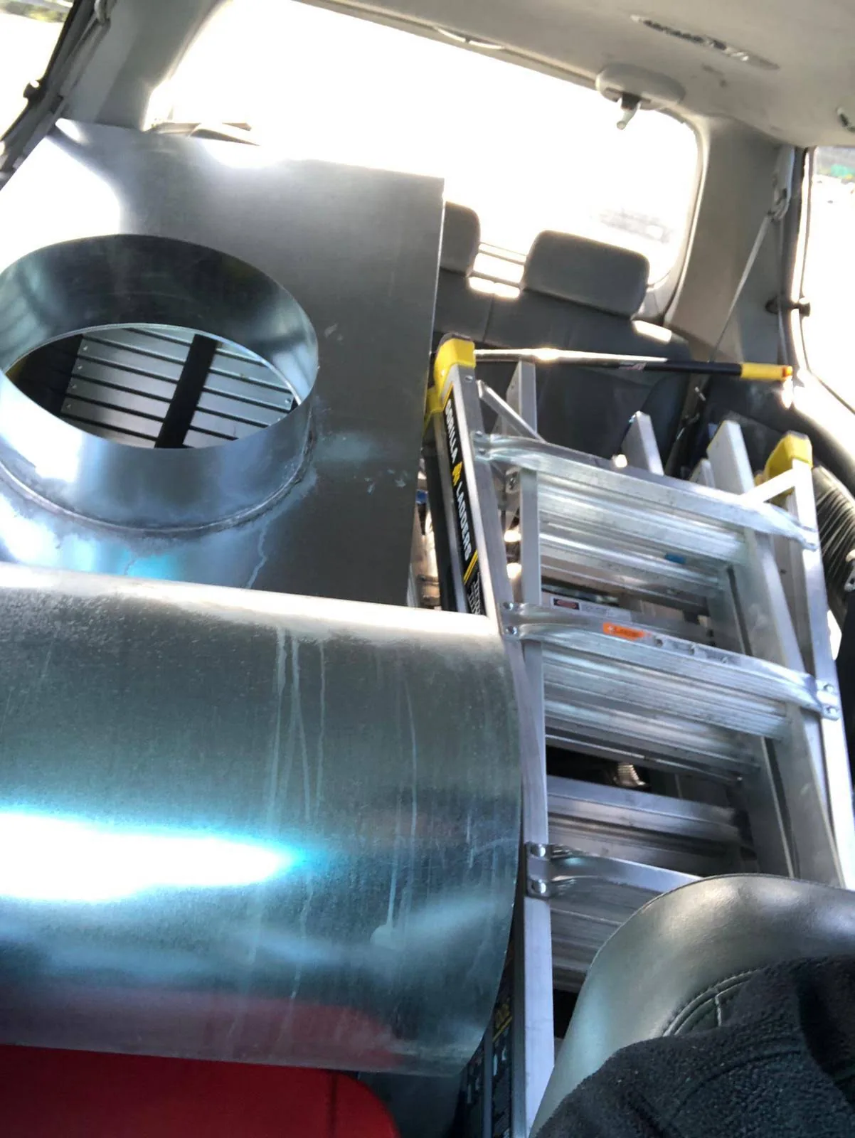 Metal venting and ladder access documented during an owner-supplied chimney inspection project
